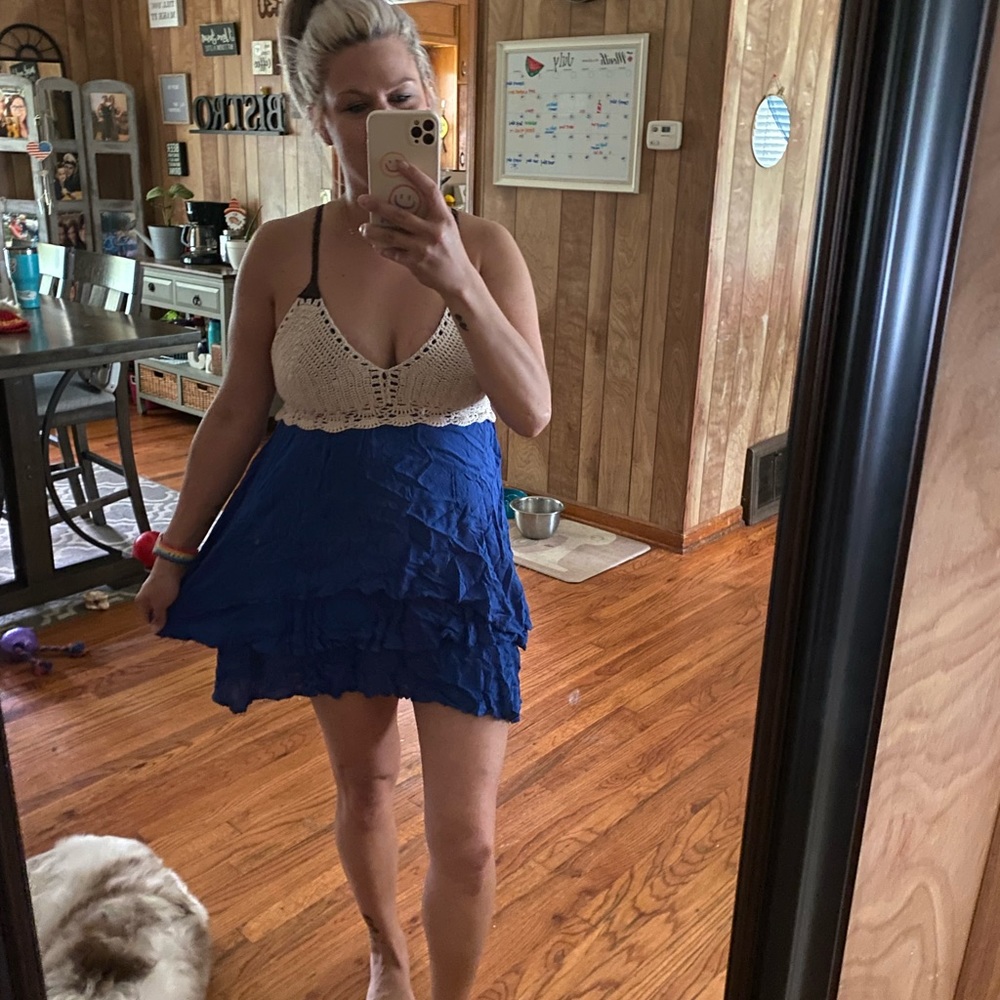 Royal blue dress with leather straps.